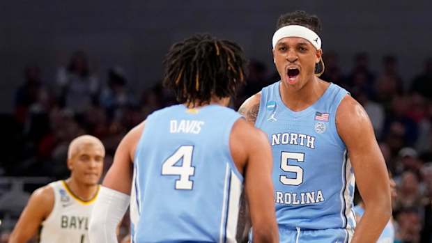 North Carolina guard RJ Davis (4) and forward Armando Bacot (5) celebrate in the second half of a second-round game against Baylor in the NCAA college basketball tournament in Fort Worth, Texas, Saturday, March, 19, 2022.